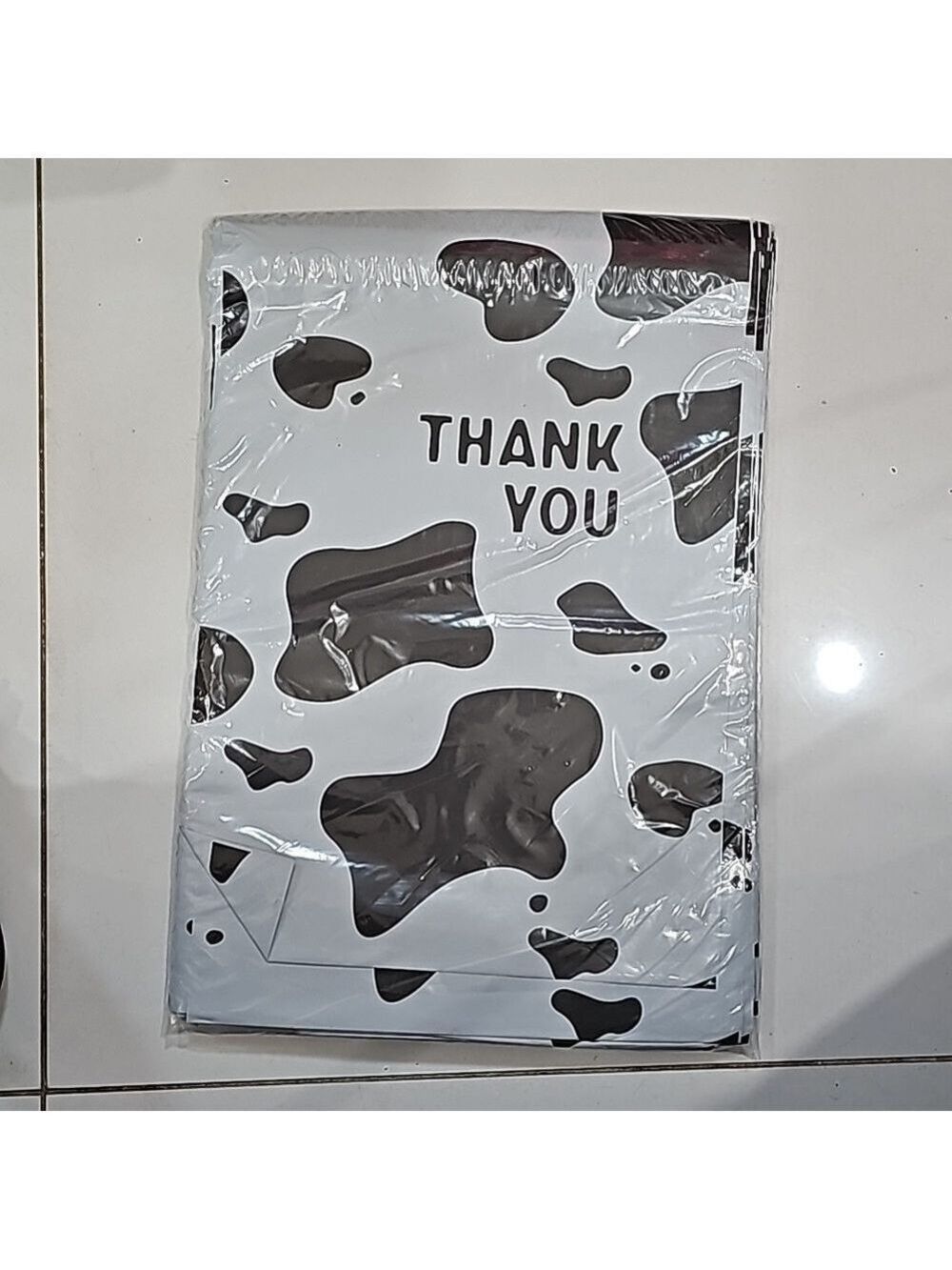Ten 10x13 poly mailer in black & white cow print